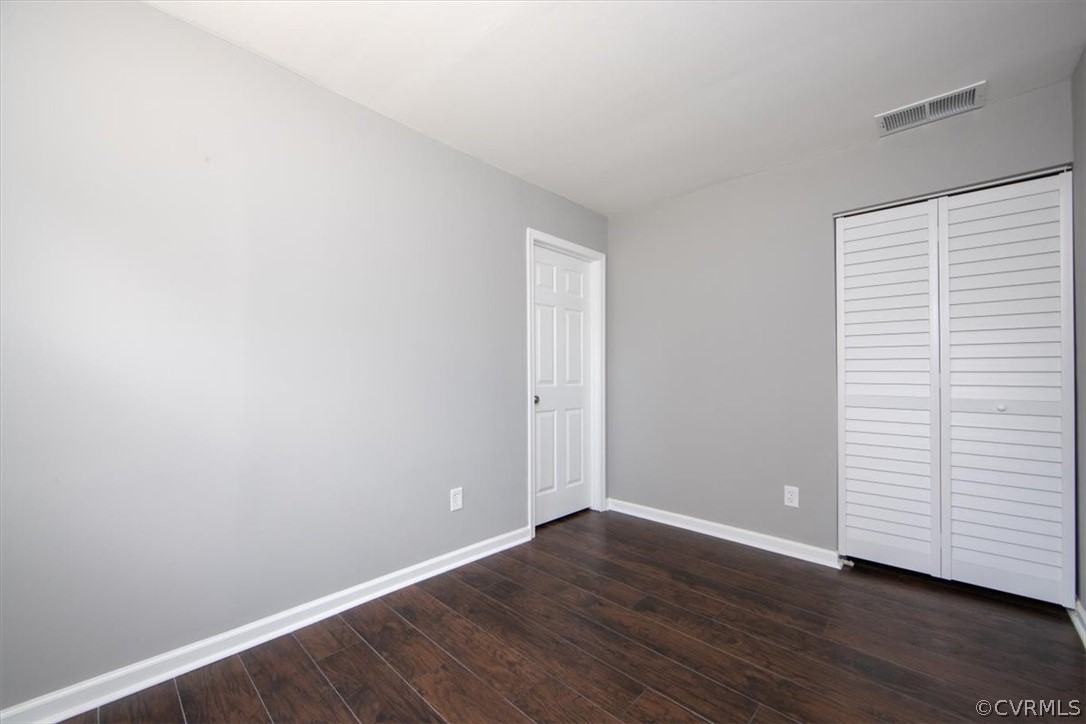 9301 Telstar Drive Richmond, VA 23237 - Photo 10 of 24 a view of an empty room with closet and a window