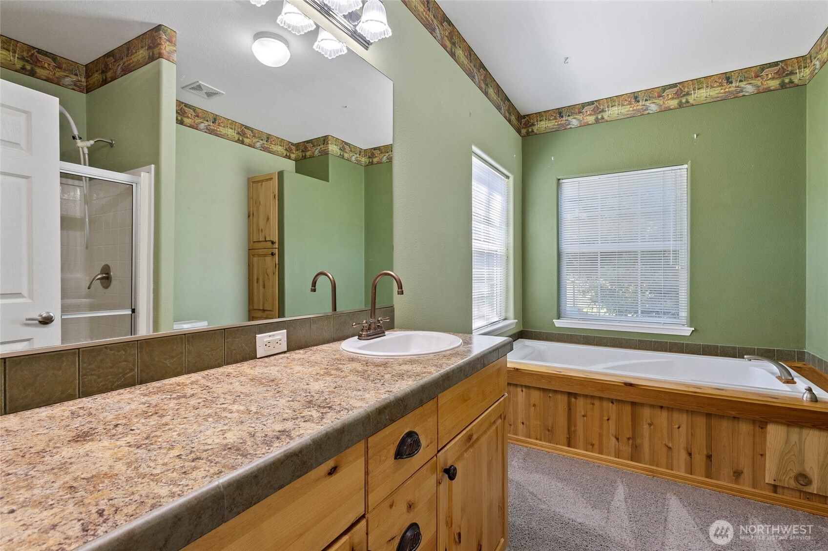 6948 Howell Lane Sedro-Woolley, WA 98284 - Photo 13 of 40 a bathroom with a granite countertop sink and a mirror