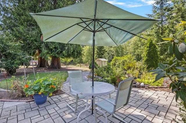 a view of a chair and table on the patio