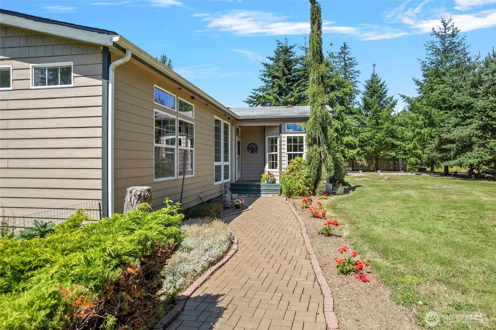 6948 Howell Lane Sedro-Woolley, WA 98284 - Photo 31 of 40 a front view of a house with garden