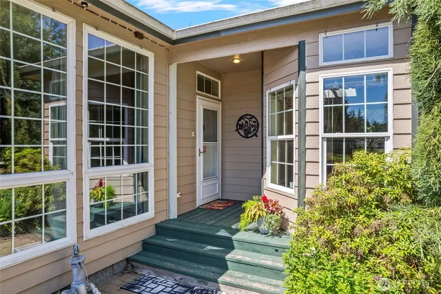a front view of a house with a garden