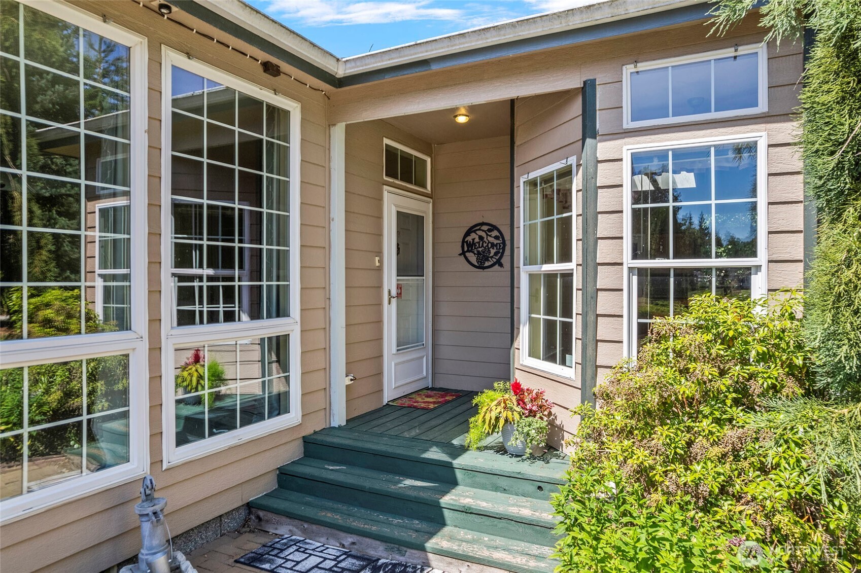 6948 Howell Lane Sedro-Woolley, WA 98284 - Photo 32 of 40 a front view of a house with a garden