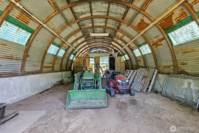 a view of an chairs and bench in the roof deck