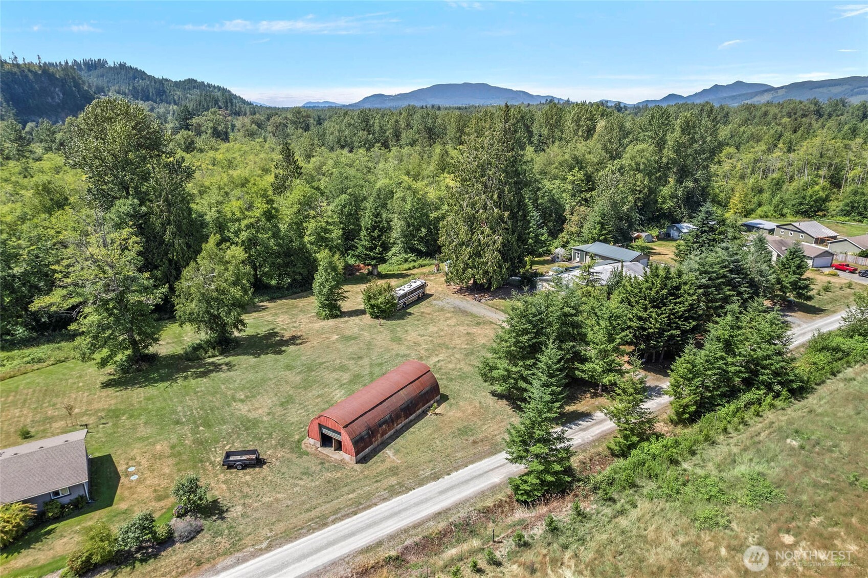 6948 Howell Lane Sedro-Woolley, WA 98284 - Photo 36 of 40 a view of a lush green hillside and houses