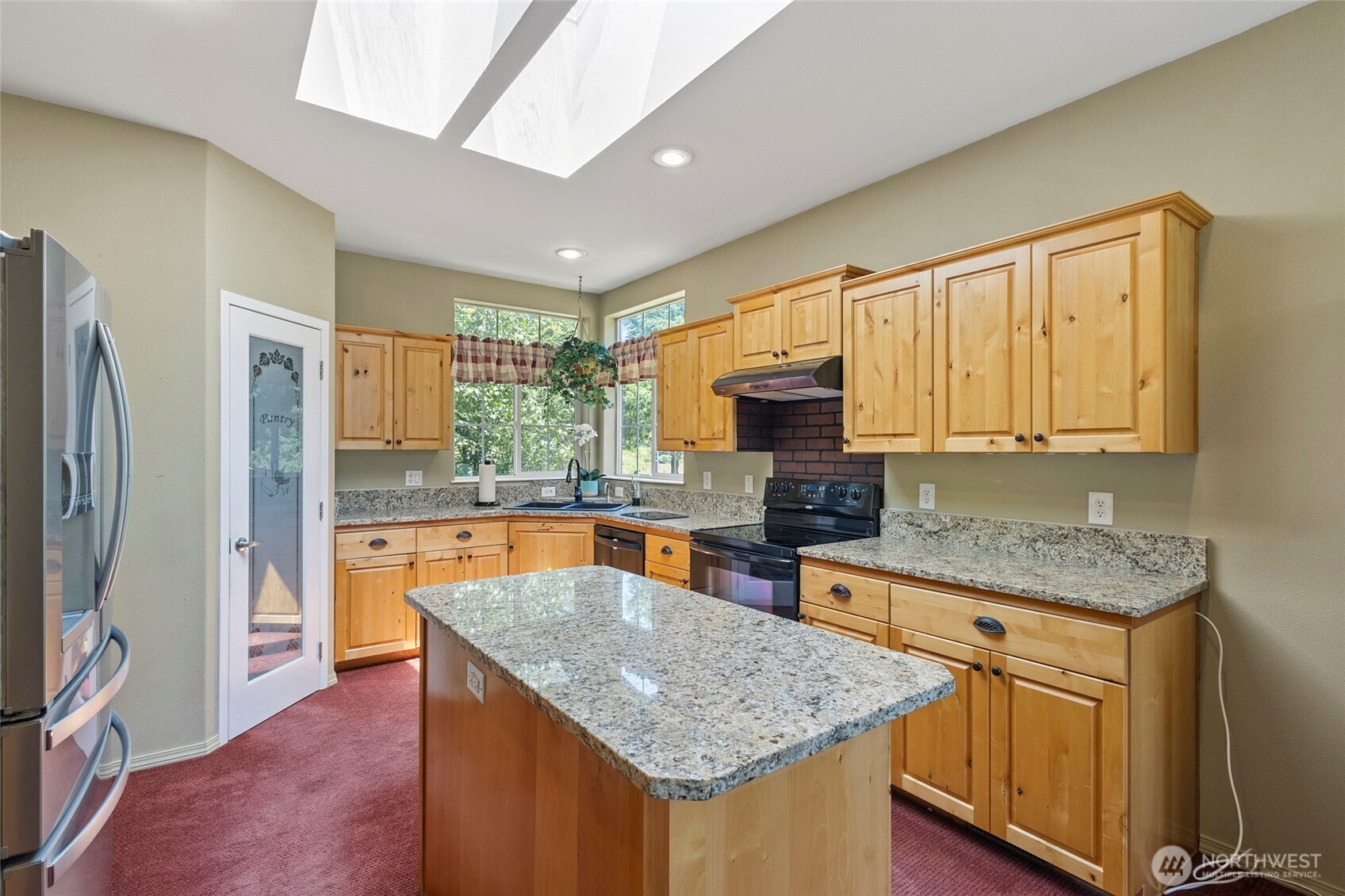 6948 Howell Lane Sedro-Woolley, WA 98284 - Photo 7 of 40 a kitchen with stainless steel appliances granite countertop a sink stove and refrigerator