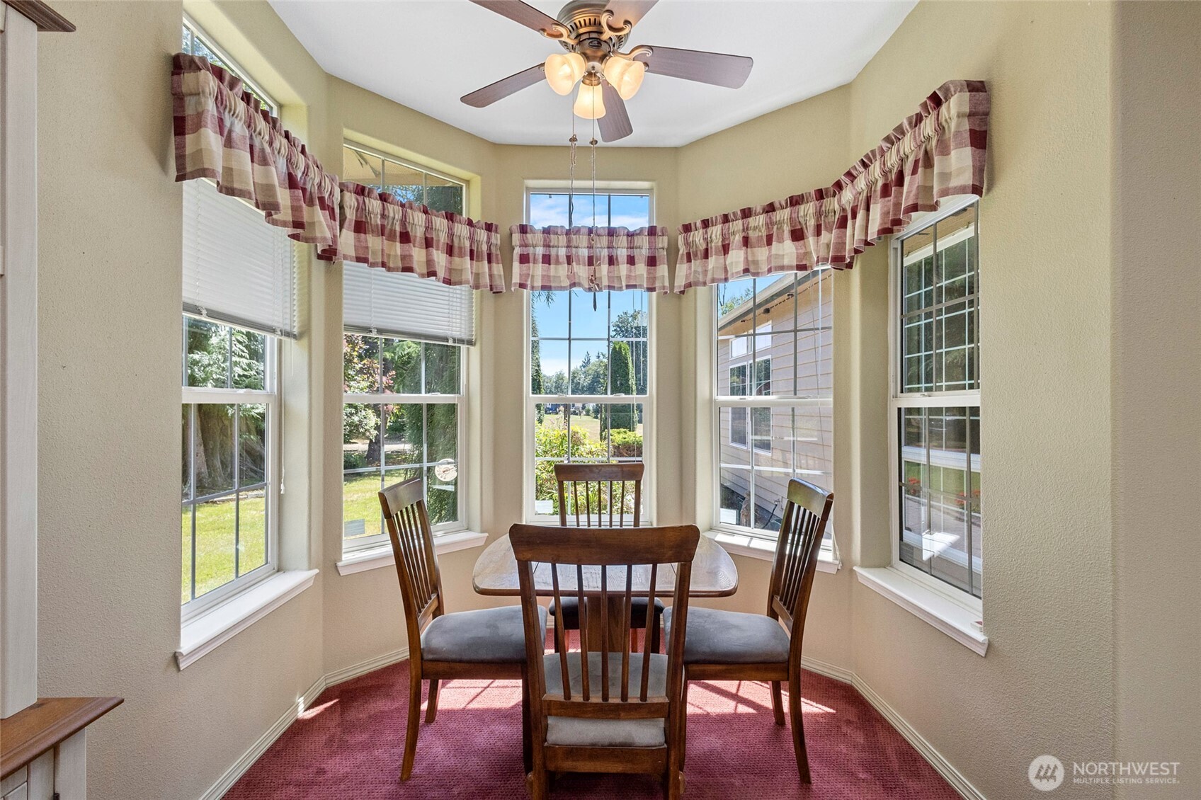 6948 Howell Lane Sedro-Woolley, WA 98284 - Photo 8 of 40 a view of a dining room with furniture a chandelier and wooden floor