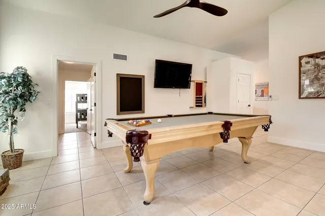 a kitchen with a refrigerator a stove a sink dishwasher with a dining table and chairs