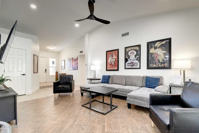 a view of a dining room with furniture and a window
