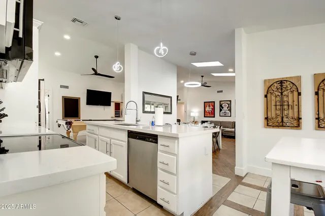 a bedroom with two beds and a window