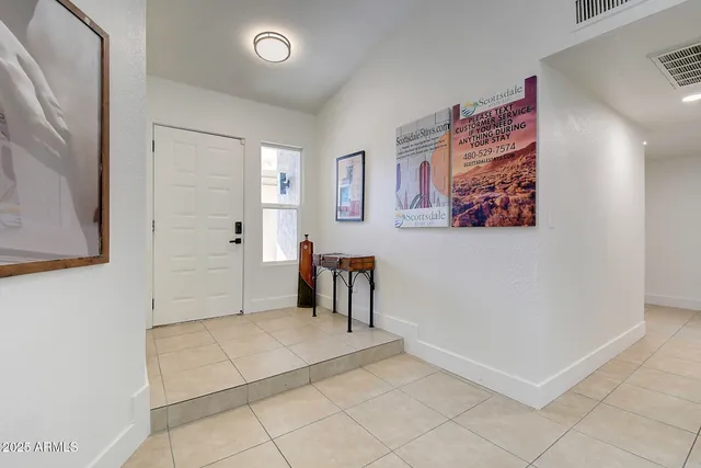 a bedroom with double bed and a lamp