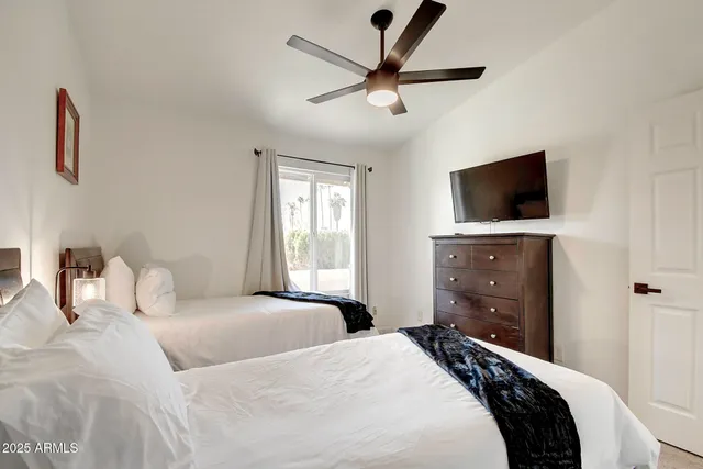 a bedroom with a bed and a lamp