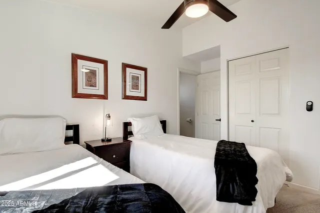 a bathroom with a toilet sink vanity and mirror