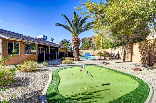 a view of a swimming pool with a patio