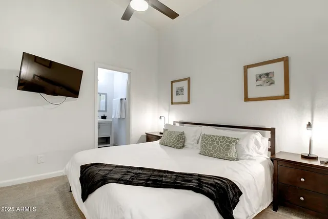 a bathroom with a shower sink and mirror