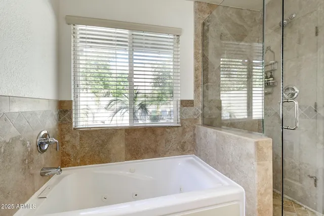 a living room with furniture ceiling fan and a rug