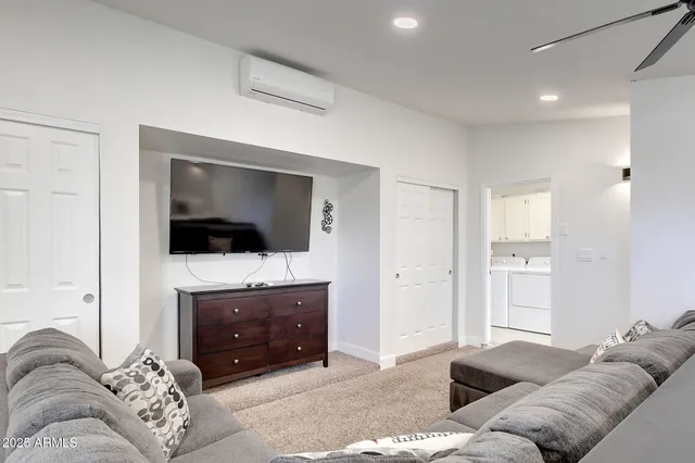 a swimming pool with outdoor seating and yard