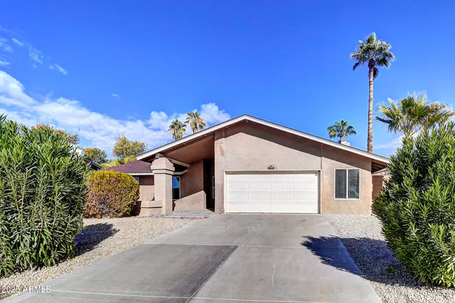 a view of an outside dining space with furniture