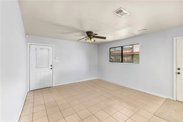 a view of a ceiling fan and hardwood floor