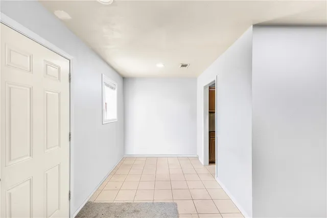 a view of an empty room and window