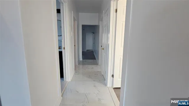 a view of a hallway with closet