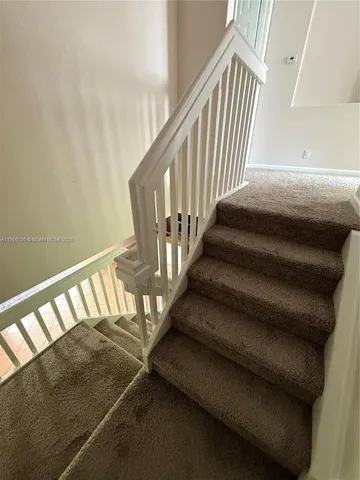 a view of a room with a hallway