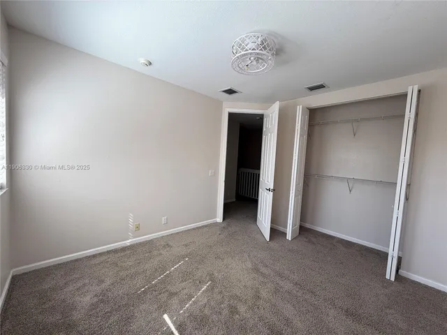 a view of a hallway with a livingroom