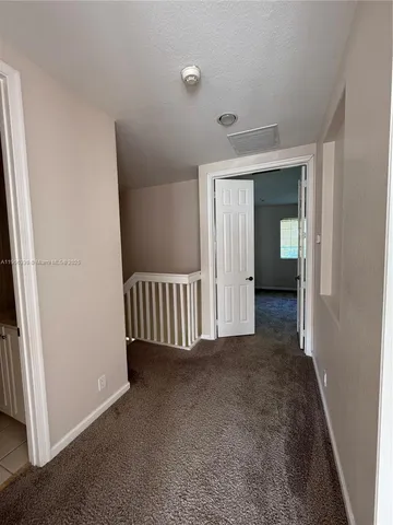 an empty room with ceiling fan and a ceiling fan