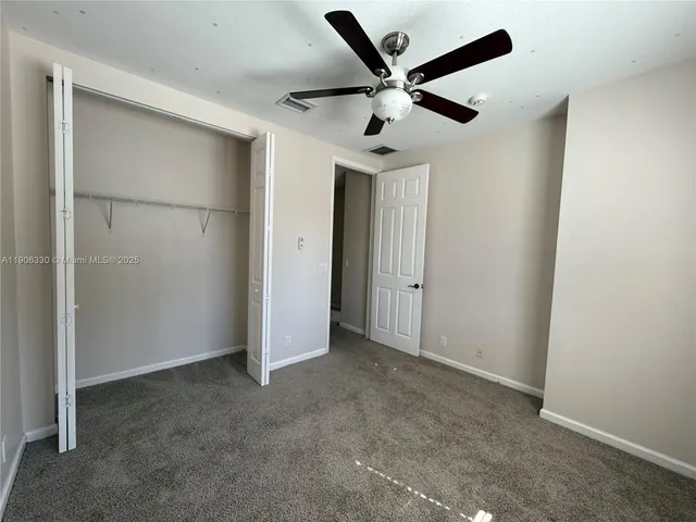 a view of an empty walk in closet