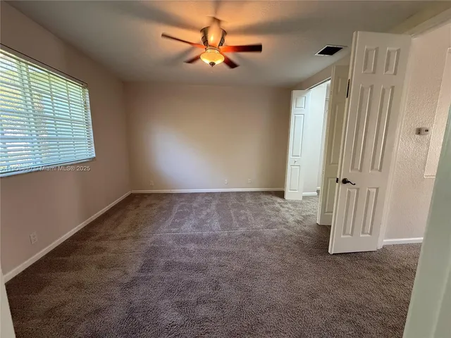 a bathroom with a tub and a shower
