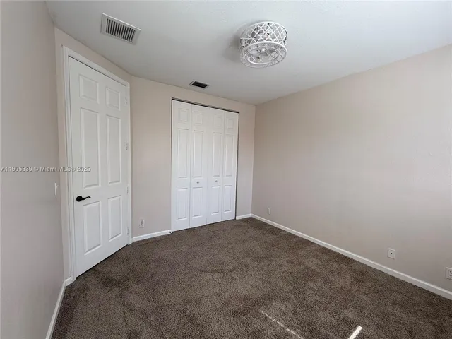 a view of a lake with a yard