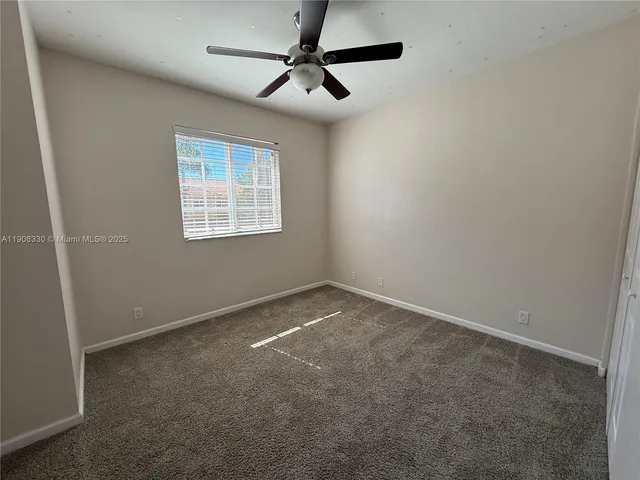 a view of a chairs and table in patio