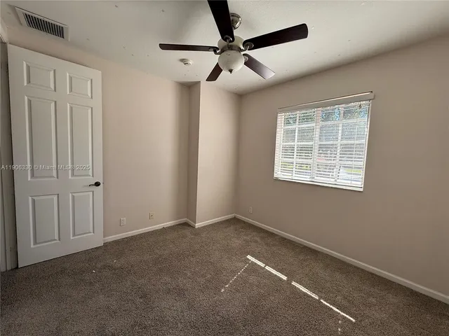 a view of a lake with houses in the background