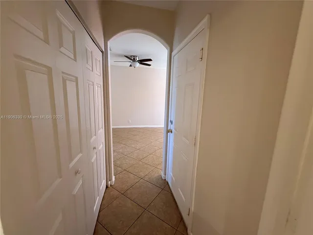 a bathroom with a shower and a glass door