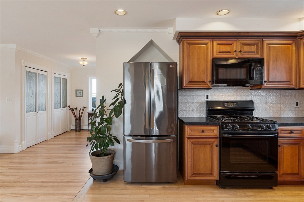 303 Nahant Road Nahant, MA 01908 - Photo 18 of 41 a kitchen with a refrigerator and a stove