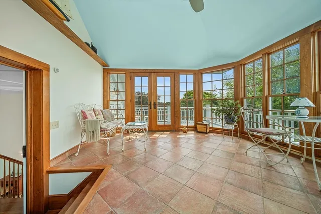 a kitchen with stainless steel appliances granite countertop a refrigerator a stove top oven a sink and dishwasher with wooden floor