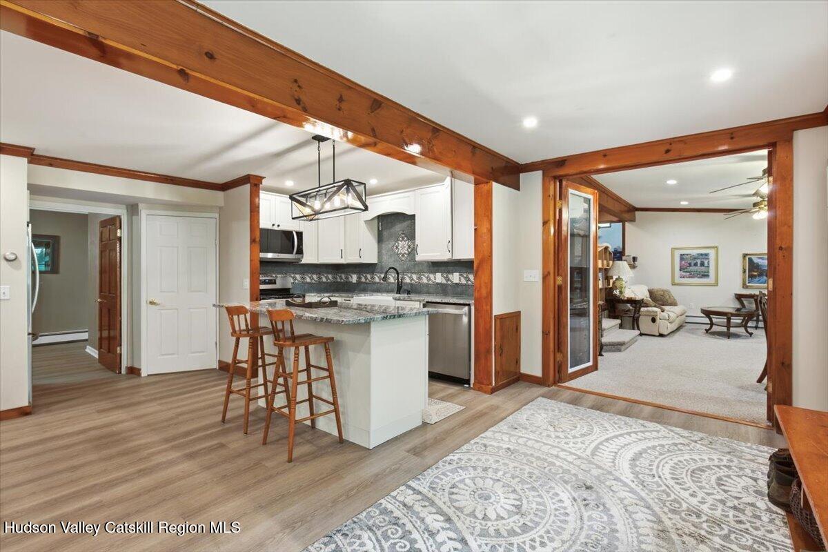 31 Favorito Road Round Top, NY 12473 - Photo 9 of 57 09-Unit 1 Main Floor Kitchen to LR