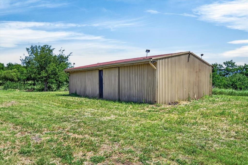 1129 Ragsdale Street Terrell, TX 75160 - Photo 17 of 29 metal storage building, has dirt flooring