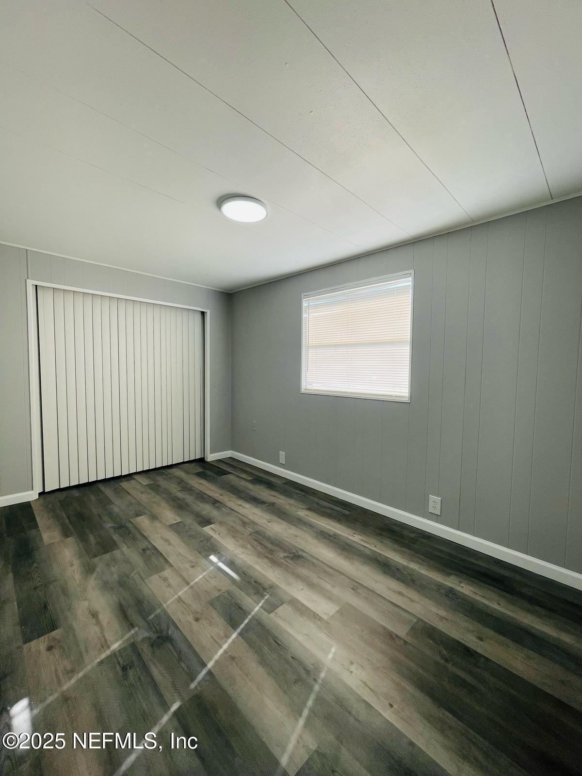 8660 Maynard Place Jacksonville, FL 32222 - Photo 11 of 14 a view of an empty room with a window