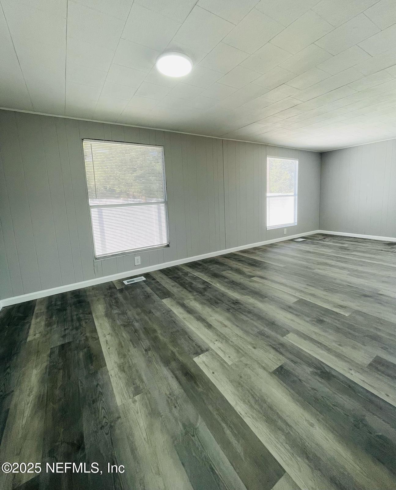 8660 Maynard Place Jacksonville, FL 32222 - Photo 2 of 14 a view of an empty room and window