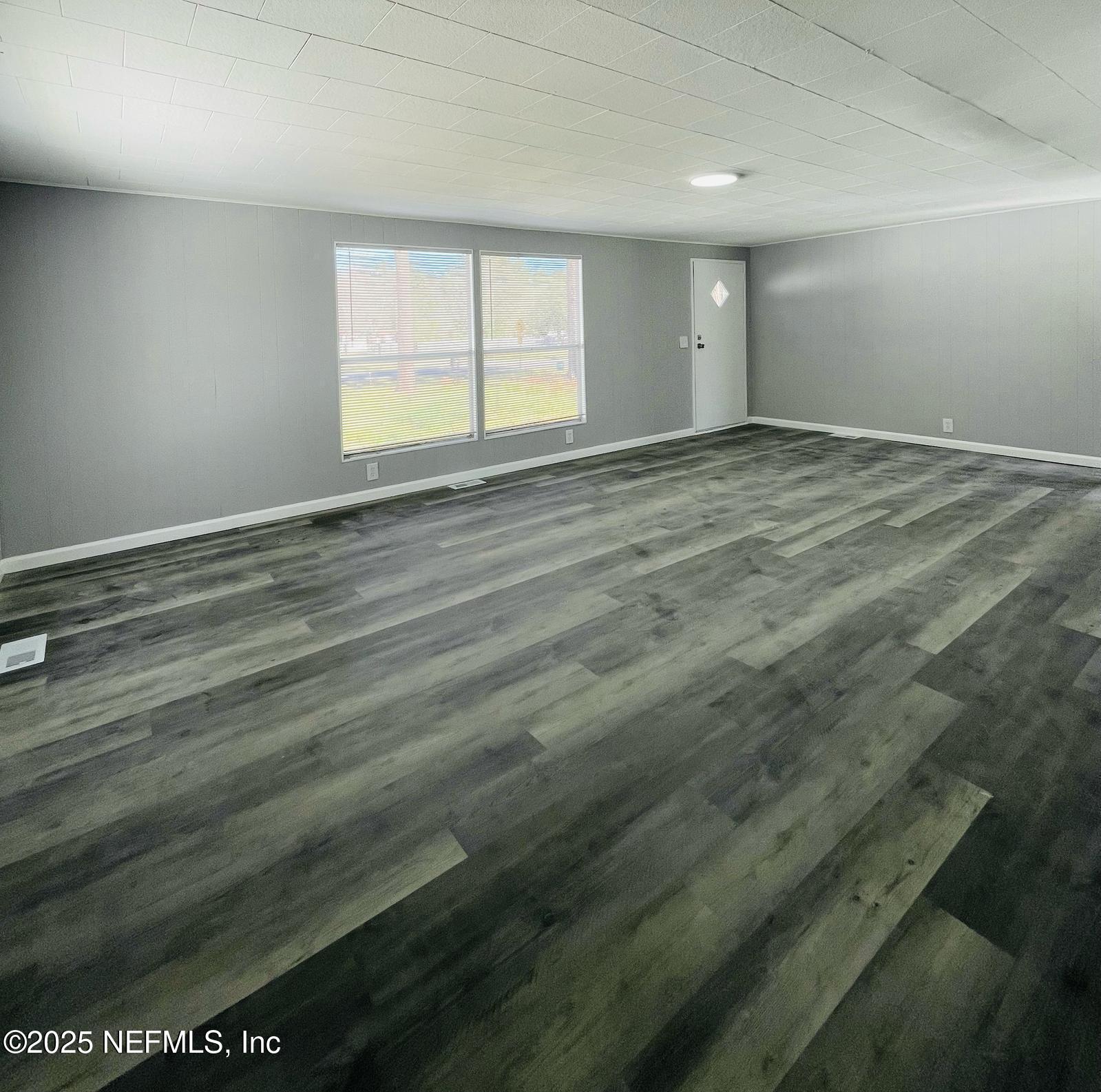 8660 Maynard Place Jacksonville, FL 32222 - Photo 3 of 14 wooden floor in an empty room