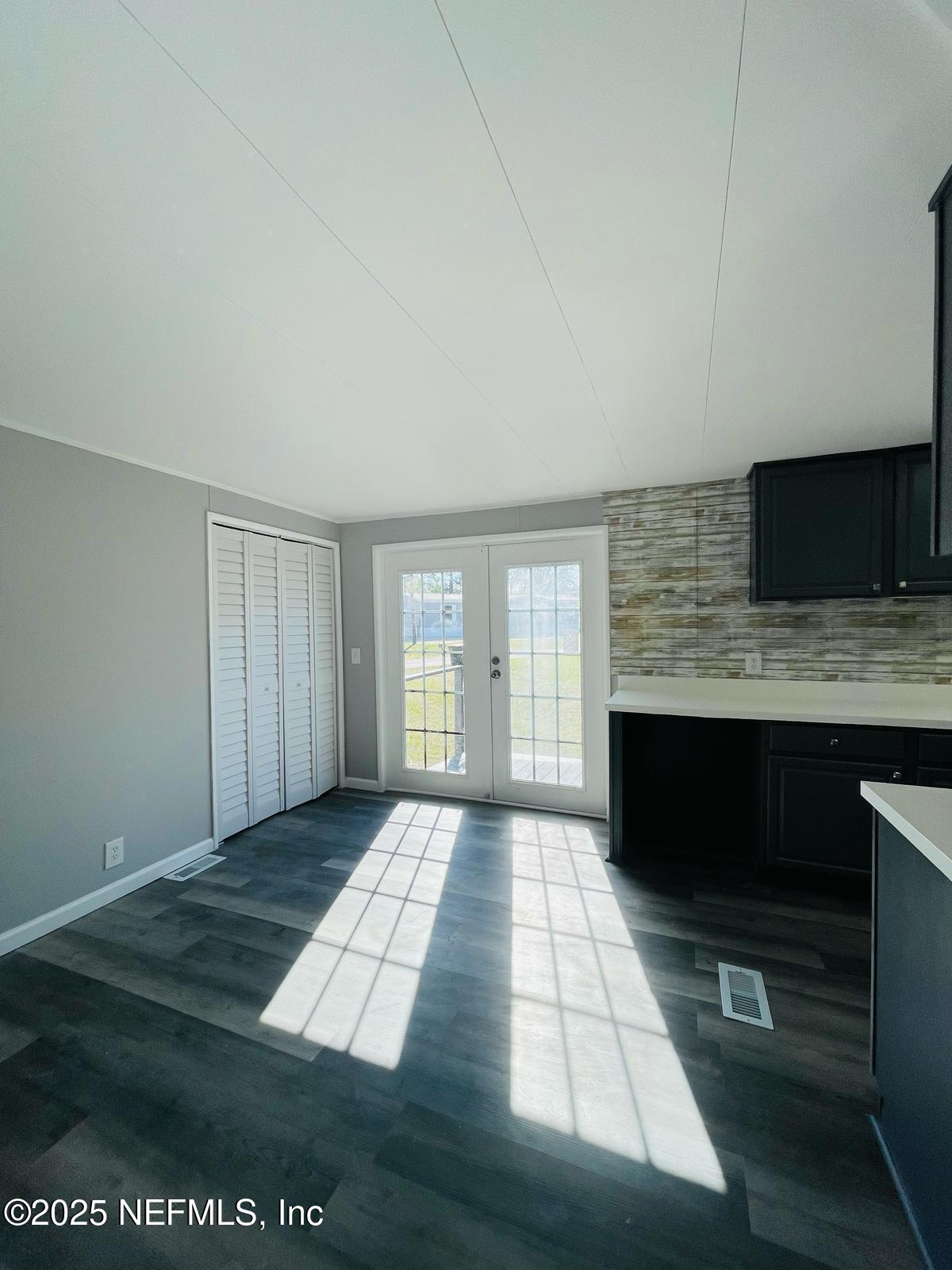 8660 Maynard Place Jacksonville, FL 32222 - Photo 7 of 14 a view of an empty room with a fireplace and a window