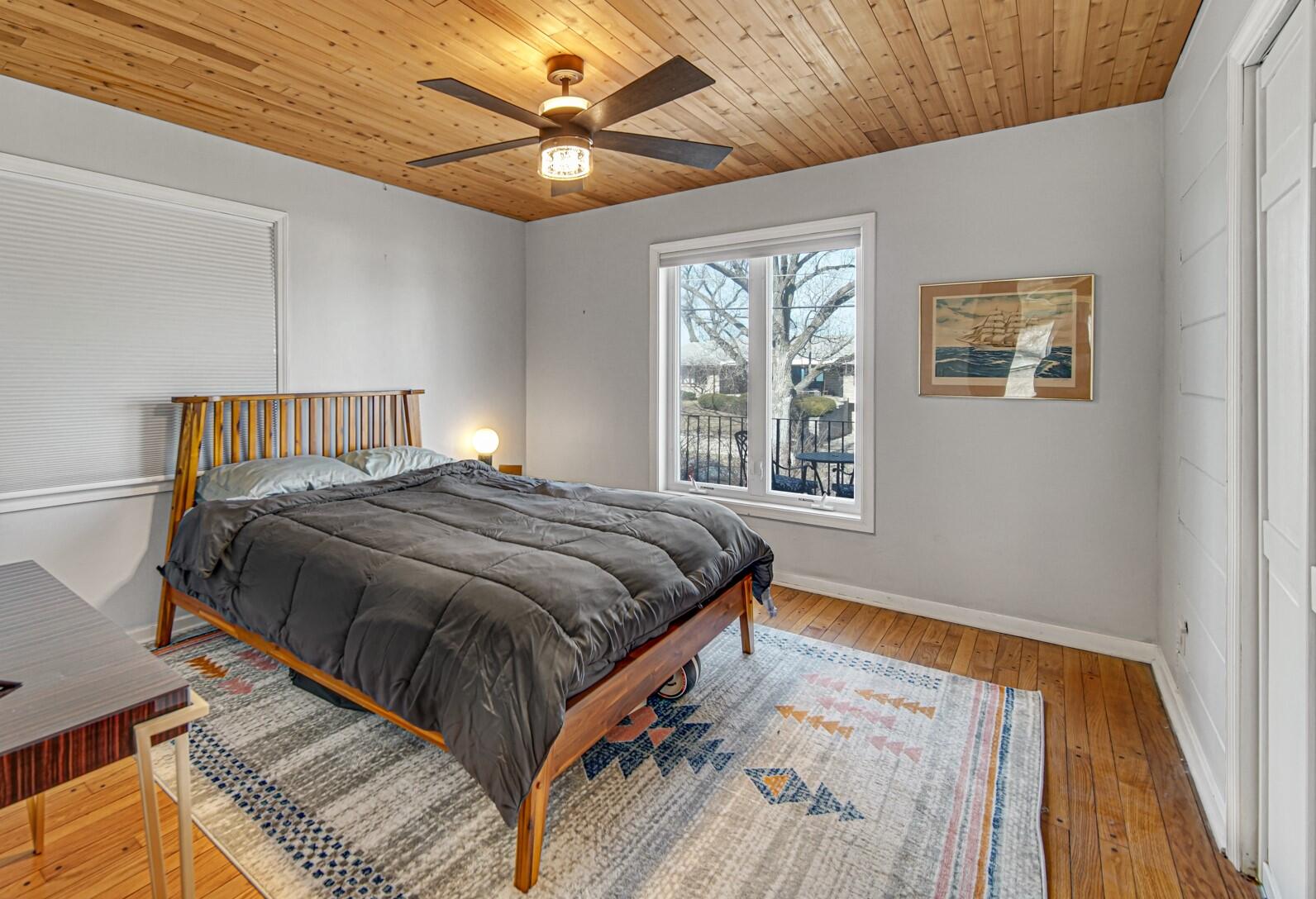 131 Shore Drive Portage, IN 46368 - Photo 12 of 30 a bed sitting in a bedroom next to a window