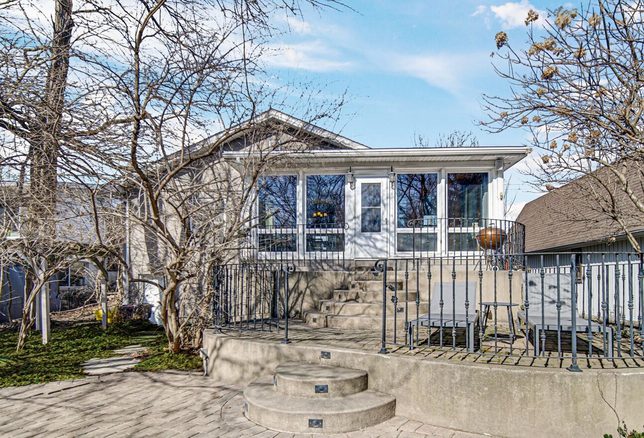 131 Shore Drive Portage, IN 46368 - Photo 19 of 30 a front view of a house with a tree