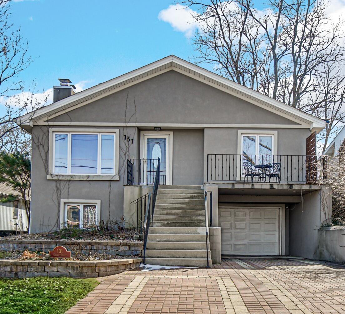 131 Shore Drive Portage, IN 46368 - Photo 2 of 30 a front view of a house with garden