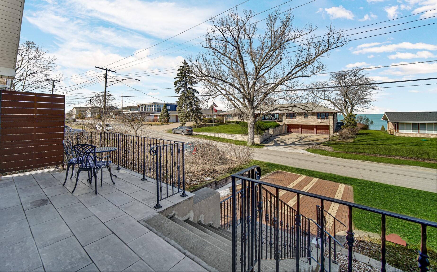 131 Shore Drive Portage, IN 46368 - Photo 5 of 30 a view of a pathway with a wrought iron stairs
