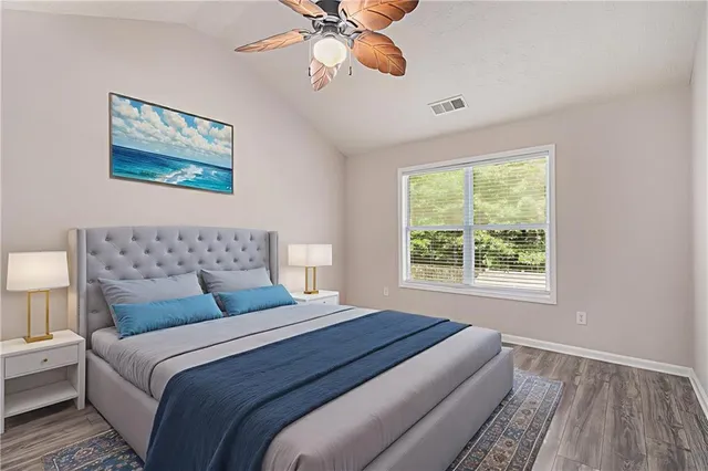 a bedroom with bed and a window