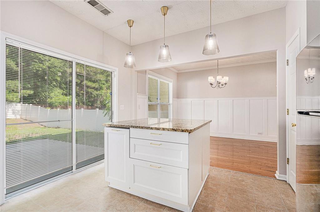 1576 Thornwick Trace Stockbridge, GA 30281 - Photo 9 of 30 a bathroom with a granite countertop sink a large mirror and a shower