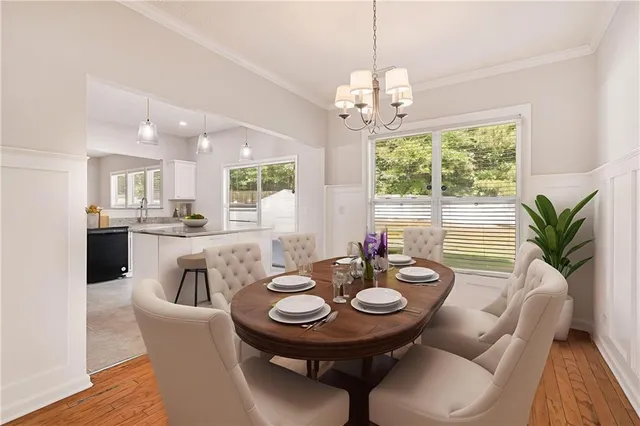 a view of a dining room with furniture window and wooden floor