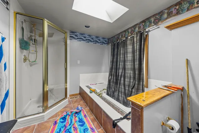 a room with a bed and a mirror