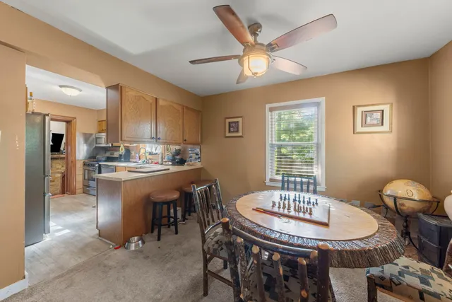 a dining room with furniture and window